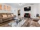 Living room with fireplace, hardwood floors and comfortable seating at 188 Brandon Ridge Cir, Stockbridge, GA 30281