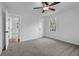 Bedroom featuring neutral carpet, ceiling fan, a window and a closet at 1900 Gober Se Ave, Smyrna, GA 30080