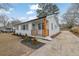 An inviting home with a freshly painted exterior, showcasing a welcoming entrance and manicured front yard at 1900 Gober Se Ave, Smyrna, GA 30080