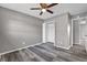 Bedroom with double door closet, ceiling fan and grey floors at 4701 Flat Shoals Rd # 49C, Union City, GA 30291