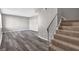 Living room with grey walls, wood-look floors and staircase at 4701 Flat Shoals Rd # 49C, Union City, GA 30291