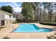 Community pool surrounded by mature trees and greenery at 6806 Glenridge Dr # E, Atlanta, GA 30328