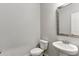 Simple, clean bathroom with a pedestal sink and a toilet at 821 Ethereow Ct, Lawrenceville, GA 30046