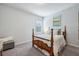 Bright bedroom with carpeted floors and a wooden bed frame at 821 Ethereow Ct, Lawrenceville, GA 30046