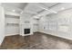 Bright Gathering room with hardwood floors, fireplace, and built-in shelves at 821 Ethereow Ct, Lawrenceville, GA 30046