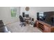 Home office featuring a large TV and comfortable workspace at 821 Ethereow Ct, Lawrenceville, GA 30046