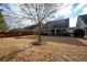 Grass backyard with wooden privacy fence at 121 Meridian Dr, Woodstock, GA 30188