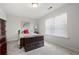 Spacious bedroom with a queen-size bed and window at 121 Meridian Dr, Woodstock, GA 30188