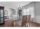Bright dining area with hardwood floors, chandelier, and striped chairs at 121 Meridian Dr, Woodstock, GA 30188