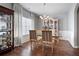 Spacious dining room with hardwood floors, large windows, and glass-top table at 121 Meridian Dr, Woodstock, GA 30188