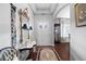 Bright entryway with hardwood floors, ornate mirror, and decorative rug at 121 Meridian Dr, Woodstock, GA 30188
