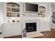 Fireplace with built-in white cabinets and shelves at 121 Meridian Dr, Woodstock, GA 30188