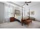 Main bedroom with a post bed and carpet flooring at 121 Meridian Dr, Woodstock, GA 30188