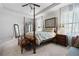 Main bedroom with a post bed and carpet flooring at 121 Meridian Dr, Woodstock, GA 30188