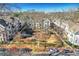 Community view showcasing a tree-lined courtyard and townhomes at 160 Cricket Ln, Alpharetta, GA 30009