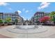 Circular fountain in the center of a town square at 160 Cricket Ln, Alpharetta, GA 30009