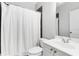 Small bathroom with white vanity and shower at 1617 Gilstrap Nw Ln, Atlanta, GA 30318