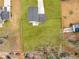 A bird's eye view of a property highlighting a spacious backyard and convenient patio area at 3 Derrick Ave, Hampton, GA 30228