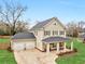 A lovely home with a two-car garage and inviting front porch situated on a well-manicured lot at 3 Derrick Ave, Hampton, GA 30228