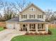Charming two-story home features a welcoming front porch and well-maintained landscaping at 3 Derrick Ave, Hampton, GA 30228