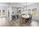 Bright kitchen with stainless appliances and dining area, seamlessly connecting to the outdoors at 3 Derrick Ave, Hampton, GA 30228