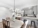 Modern kitchen with stainless steel appliances, granite countertops, and dining area at 3 Derrick Ave, Hampton, GA 30228
