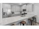 Bright kitchen features gray cabinets, stainless steel appliances, a breakfast bar, and ample counter space at 3 Derrick Ave, Hampton, GA 30228