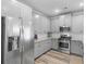 Modern kitchen with stainless steel appliances, gray cabinets, and hard surface countertops at 3 Derrick Ave, Hampton, GA 30228