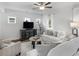 Well-lit living room featuring contemporary furnishings, hardwood floors, and neutral color palette at 3 Derrick Ave, Hampton, GA 30228