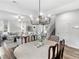 Expansive open-concept living area with large windows, hardwood flooring and modern finishes at 3 Derrick Ave, Hampton, GA 30228
