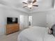 Spacious main bedroom with dresser, ceiling fan, and ensuite bathroom access at 3 Derrick Ave, Hampton, GA 30228