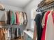 Organized walk-in closet with ample storage shelves and hanging space at 3 Derrick Ave, Hampton, GA 30228