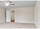 Spacious bedroom with carpet, ceiling fan and access to bathroom at 4760 Black Onyx Path, Kennesaw, GA 30144