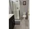 Basement bathroom with shower stall, toilet and granite vanity at 1345 Keys Crossing Ne Dr # 1345, Atlanta, GA 30319