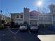 Front view of condo building with parking lot and landscaping at 1345 Keys Crossing Ne Dr # 1345, Atlanta, GA 30319