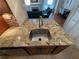 Modern kitchen sink and granite countertops are shown in this image at 1345 Keys Crossing Ne Dr # 1345, Atlanta, GA 30319