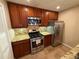 Updated kitchen with wood cabinets, granite countertops, and stainless steel appliances at 1345 Keys Crossing Ne Dr # 1345, Atlanta, GA 30319