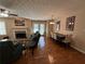 Spacious living room features hardwood floors, fireplace and dining area at 1345 Keys Crossing Ne Dr # 1345, Atlanta, GA 30319