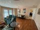 Living room with hardwood floors, dining area and access to patio at 1345 Keys Crossing Ne Dr # 1345, Atlanta, GA 30319