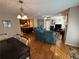 Open concept living and dining area with hardwood floors and kitchen view at 1345 Keys Crossing Ne Dr # 1345, Atlanta, GA 30319
