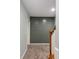 Unfinished basement with gray shiplap accent wall and carpeted floor at 1658 Duncan Nw Dr, Atlanta, GA 30318