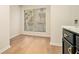 Bright dining area with light hardwood floors and large window at 2901 Lenox Ne Rd # 901, Atlanta, GA 30324