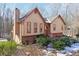 Two-story house with brick and siding exterior, deck, and landscaping at 6851 Alexander Pkwy, Douglasville, GA 30135