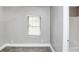 Neutral-toned bedroom with carpeting and a large window for plenty of sunlight at 2222 Mcafee Rd, Decatur, GA 30032