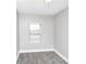 Bedroom with a window overlooking the yard, plush carpeting, and neutral paint at 2222 Mcafee Rd, Decatur, GA 30032