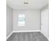 Bedroom featuring a plush carpet, a window with natural light, and neutral paint at 2222 Mcafee Rd, Decatur, GA 30032