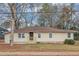 Charming single-story home with beige siding, updated windows and a small front porch at 2222 Mcafee Rd, Decatur, GA 30032