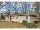 Charming one-story home with beige siding, updated windows and a small front porch at 2222 Mcafee Rd, Decatur, GA 30032