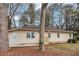 Charming one-story home with beige siding, updated windows and a small front porch at 2222 Mcafee Rd, Decatur, GA 30032