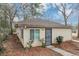 Charming single story home featuring a well-maintained yard and gated front door at 2222 Mcafee Rd, Decatur, GA 30032
